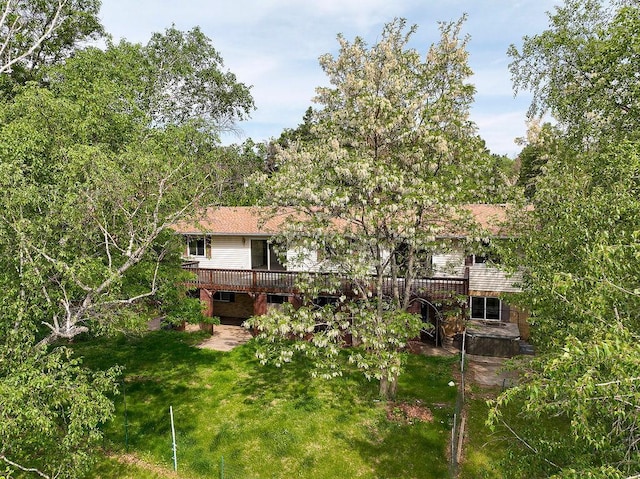 43394 Long Lake Ln, Ottertail, MN 56571 - back of property with a wooden deck and a lawn