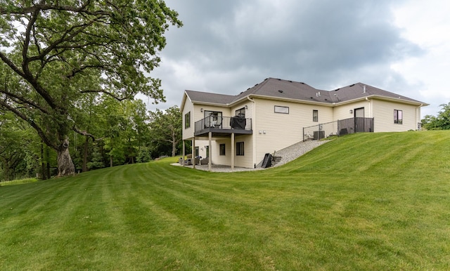 4338 Stone Crest Ln NE, Rochester, MN 55906 - back of property featuring a yard, a deck, and central air condition unit