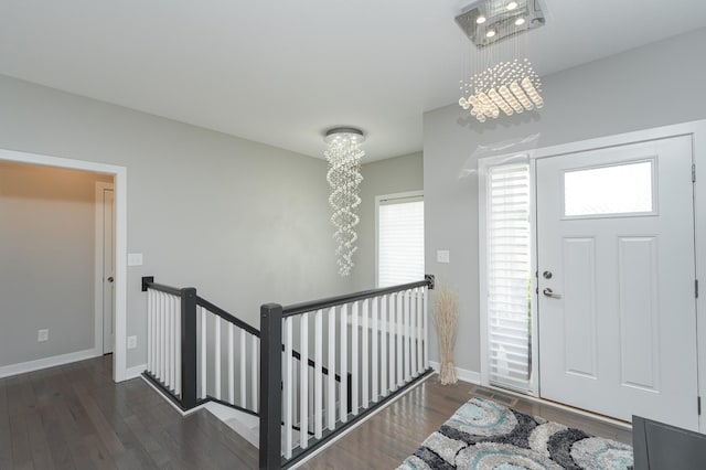 4338 Stone Crest Ln NE, Rochester, MN 55906 - entryway featuring wood finished floors, baseboards, and a chandelier