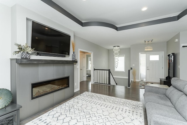 4338 Stone Crest Ln NE, Rochester, MN 55906 - living area with wood finished floors, recessed lighting, a glass covered fireplace, and baseboards