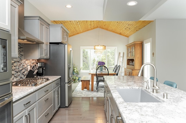 4338 Stone Crest Ln NE, Rochester, MN 55906 - kitchen with a sink, gray cabinetry, stainless steel appliances, wall chimney exhaust hood, and wood finished floors