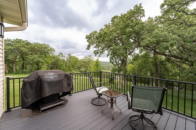 4338 Stone Crest Ln NE, Rochester, MN 55906 - deck featuring a grill, a yard, and view of wooded area