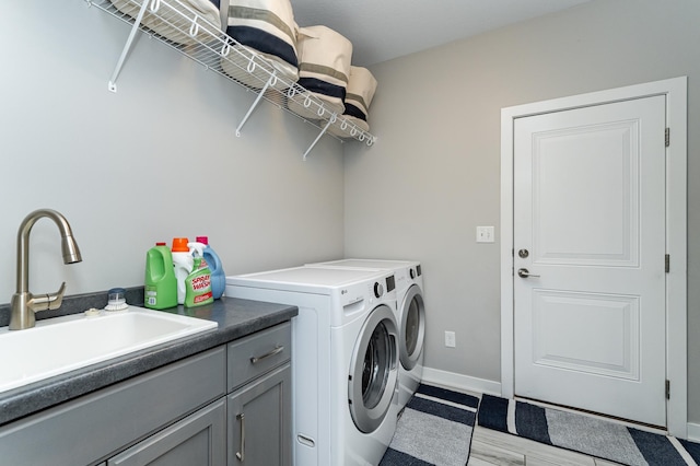 4338 Stone Crest Ln NE, Rochester, MN 55906 - laundry area with washer and clothes dryer, cabinet space, and baseboards