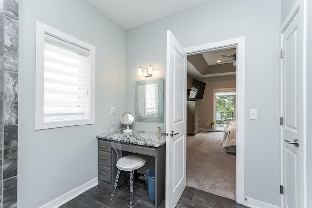 4338 Stone Crest Ln NE, Rochester, MN 55906 - bathroom featuring baseboards, connected bathroom, ceiling fan, and vanity