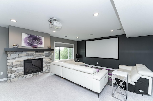 4338 Stone Crest Ln NE, Rochester, MN 55906 - carpeted home theater room with recessed lighting, a stone fireplace, and baseboards