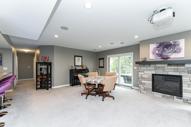 4338 Stone Crest Ln NE, Rochester, MN 55906 - carpeted dining space with baseboards, recessed lighting, and a stone fireplace