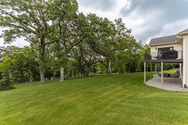 4338 Stone Crest Ln NE, Rochester, MN 55906 - view of grassy yard featuring a deck