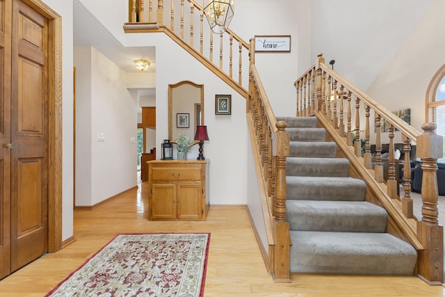 14023 Yellow Pine St NW, Andover, MN 55304 - staircase with wood finished floors and a towering ceiling