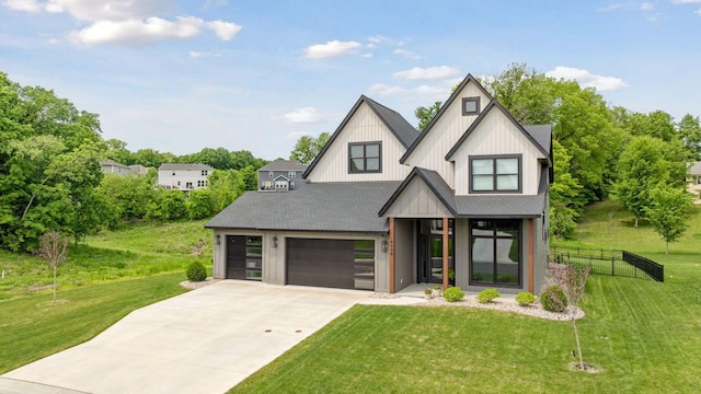 4998 Beach St NE, Prior Lake, MN 55372 - view of front facade with roof with shingles, concrete driveway, a garage, and board and batten siding