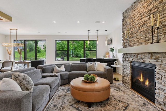 4998 Beach St NE, Prior Lake, MN 55372 - living room with recessed lighting, a stone fireplace, and wood finished floors