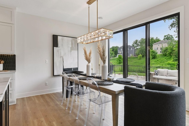 4998 Beach St NE, Prior Lake, MN 55372 - dining space with light wood-style flooring and baseboards