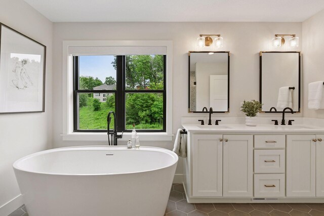 4998 Beach St NE, Prior Lake, MN 55372 - full bath with a freestanding bath, double vanity, and tile patterned floors