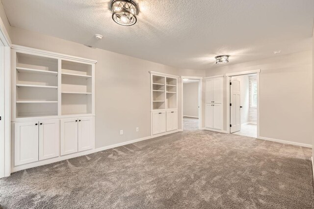 139 144th Ave NW, Andover, MN 55304 - unfurnished bedroom featuring a textured ceiling and carpet