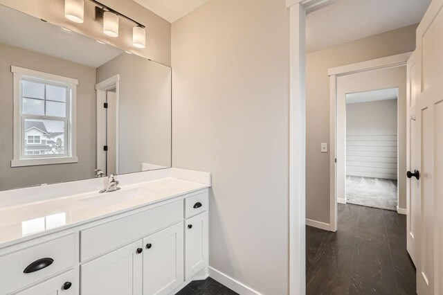 139 144th Ave NW, Andover, MN 55304 - bathroom featuring baseboards and vanity