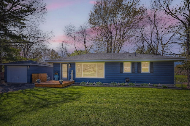 13812 Steven Rd, Burnsville, MN 55337 - view of front of home with an outdoor structure, a wooden deck, a garage, and a lawn
