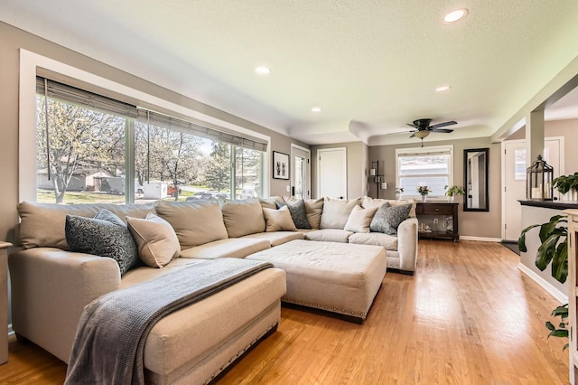 13812 Steven Rd, Burnsville, MN 55337 - living area with light wood finished floors, a ceiling fan, recessed lighting, baseboards, and a textured ceiling