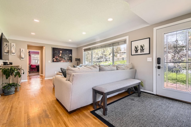 13812 Steven Rd, Burnsville, MN 55337 - living room featuring recessed lighting, light wood-style floors, and baseboards
