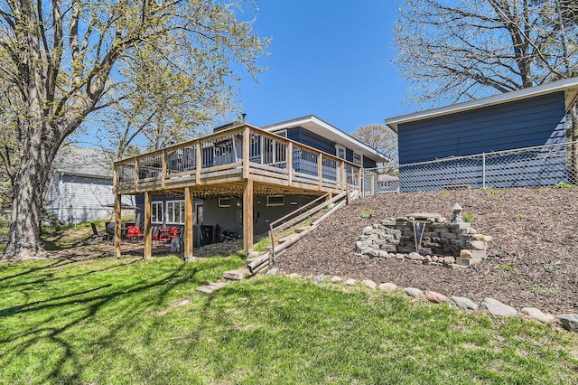13812 Steven Rd, Burnsville, MN 55337 - rear view of property featuring a deck and a lawn