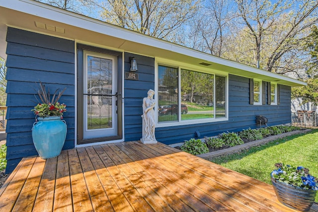13812 Steven Rd, Burnsville, MN 55337 - view of exterior entry with a wooden deck