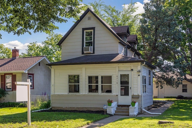 4718 Colfax Ave N, Minneapolis, MN 55430 - view of front of property featuring a front yard, entry steps, and a shingled roof