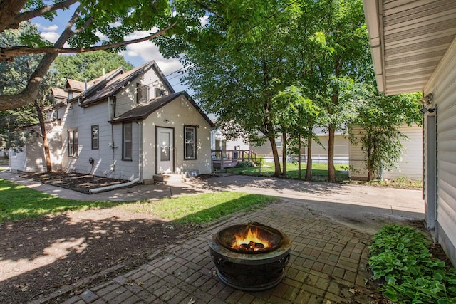 4718 Colfax Ave N, Minneapolis, MN 55430 - rear view of property with a fire pit and a patio