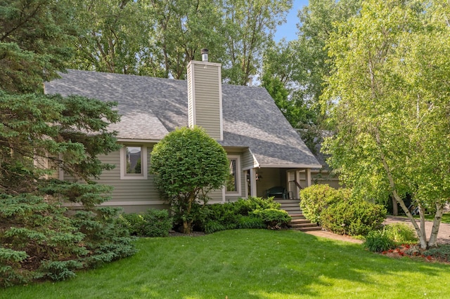 15795 Quebec Cir, Eden Prairie, MN 55346 - view of front of property featuring a front yard, roof with shingles, and a chimney