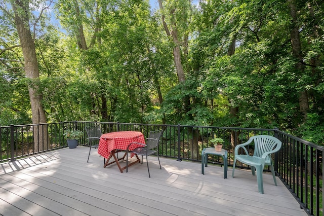 15795 Quebec Cir, Eden Prairie, MN 55346 - wooden deck with outdoor dining space and view of scattered trees