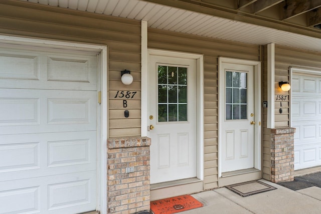 1587 County Road D E Unit B, Maplewood, MN 55109 - view of exterior entry featuring brick siding and a porch