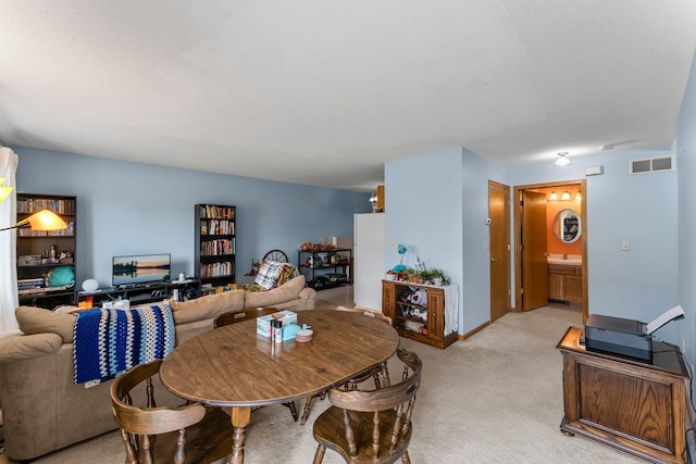 1587 County Road D E Unit B, Maplewood, MN 55109 - dining room featuring light carpet and baseboards