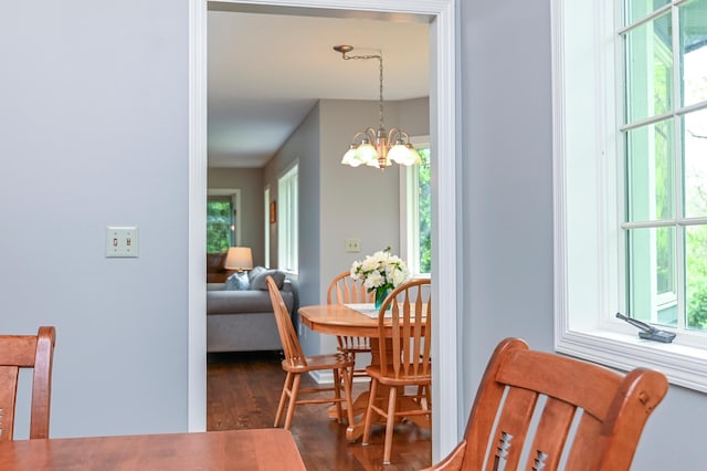 6490 White Dove Dr, Excelsior, MN 55331 - dining room featuring dark wood finished floors and a chandelier