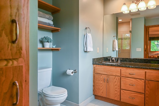6490 White Dove Dr, Excelsior, MN 55331 - bathroom featuring toilet, vanity, tiled shower, tile patterned floors, and baseboards