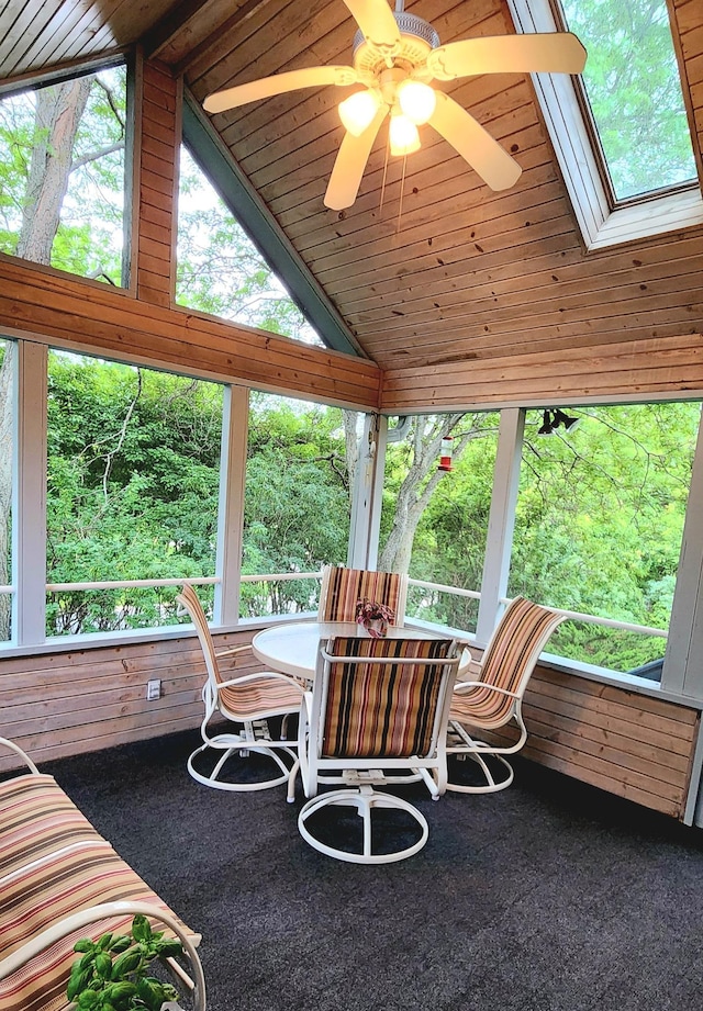 6490 White Dove Dr, Excelsior, MN 55331 - sunroom with vaulted ceiling, a skylight, ceiling fan, wood ceiling, and outdoor dining area
