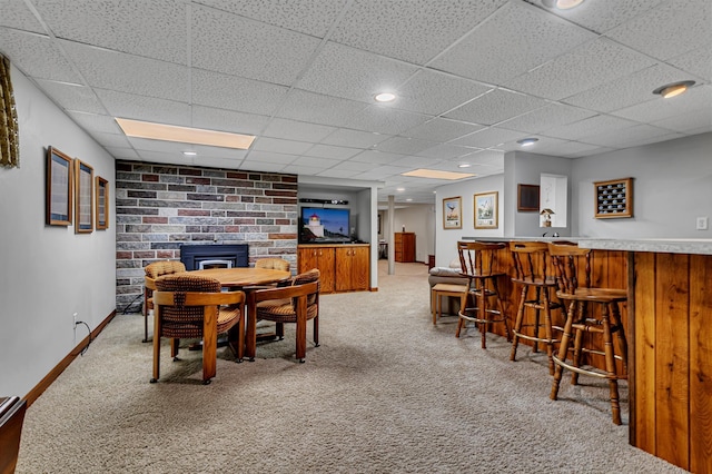 1341 75th Ave NE, Sauk Rapids, MN 56379 - dining area featuring a dry bar, light colored carpet, and a drop ceiling