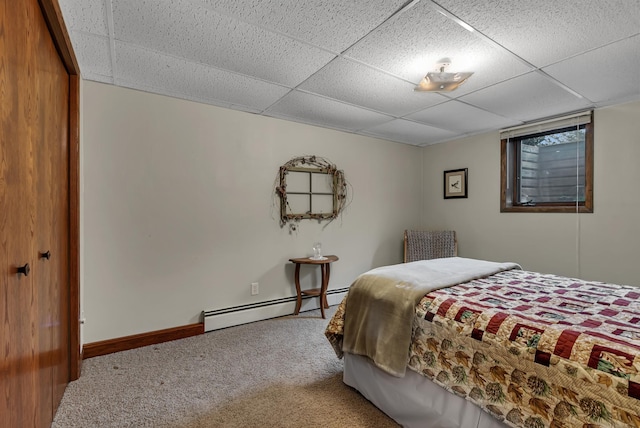 1341 75th Ave NE, Sauk Rapids, MN 56379 - carpeted bedroom with baseboard heating and a drop ceiling