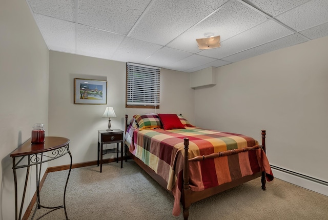 1341 75th Ave NE, Sauk Rapids, MN 56379 - carpeted bedroom with a baseboard heating unit and a drop ceiling