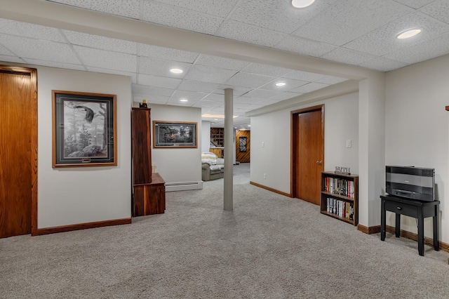 1341 75th Ave NE, Sauk Rapids, MN 56379 - finished below grade area featuring a baseboard heating unit, carpet floors, a paneled ceiling, and recessed lighting