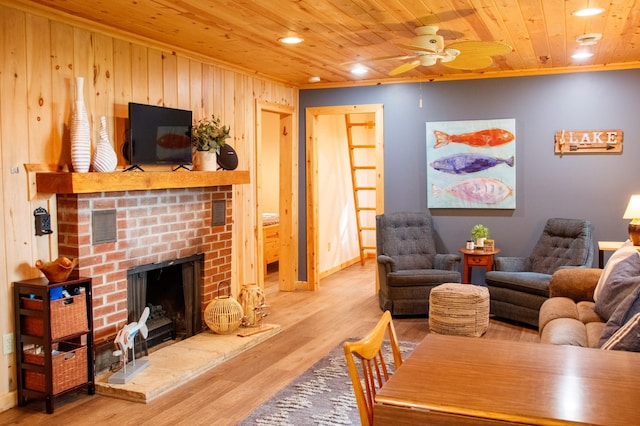 15088 Shady Oak Ln, Center Twp, MN 56465 - living area featuring a brick fireplace, wood ceiling, wood finished floors, a ceiling fan, and crown molding