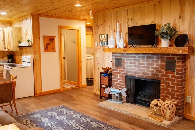 15088 Shady Oak Ln, Center Twp, MN 56465 - living room with wooden ceiling, light wood-style floors, a fireplace, wood walls, and recessed lighting