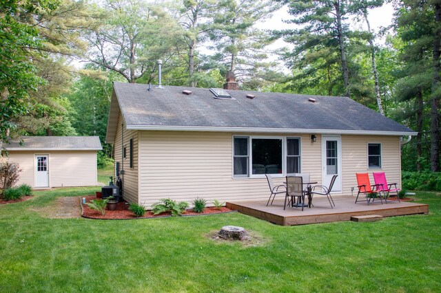15088 Shady Oak Ln, Center Twp, MN 56465 - rear view of property with a deck, a lawn, and roof with shingles