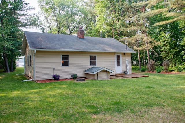 15088 Shady Oak Ln, Center Twp, MN 56465 - back of property featuring a chimney, a yard, and roof with shingles