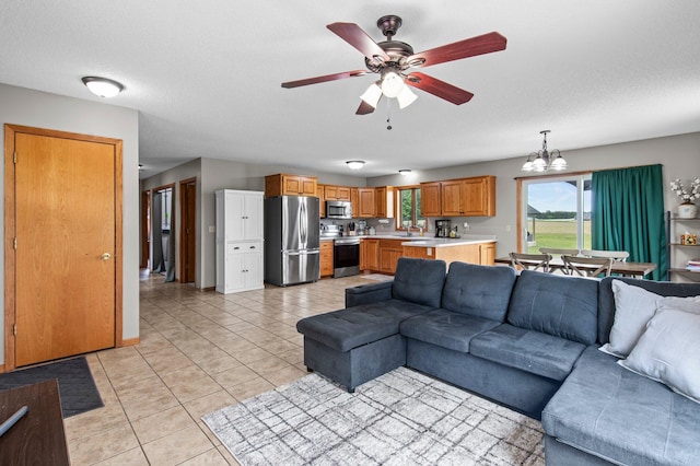 32147 111 1/2 St, Baldwin Twp, MN 55371 - living room with a chandelier, ceiling fan, and light tile patterned flooring