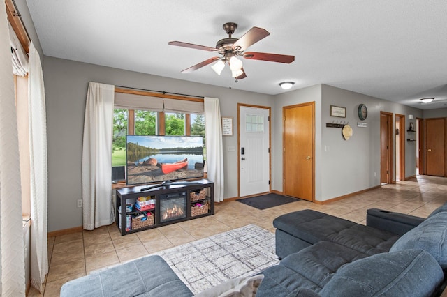 32147 111 1/2 St, Baldwin Twp, MN 55371 - tiled living area with baseboards and ceiling fan