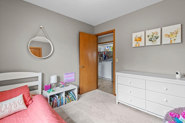 32147 111 1/2 St, Baldwin Twp, MN 55371 - bedroom with washer and clothes dryer, carpet flooring, and a textured ceiling