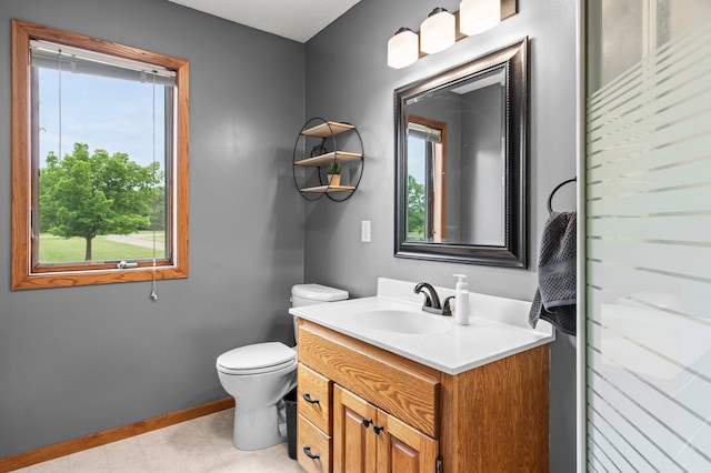 32147 111 1/2 St, Baldwin Twp, MN 55371 - bathroom featuring healthy amount of natural light, vanity, toilet, and baseboards