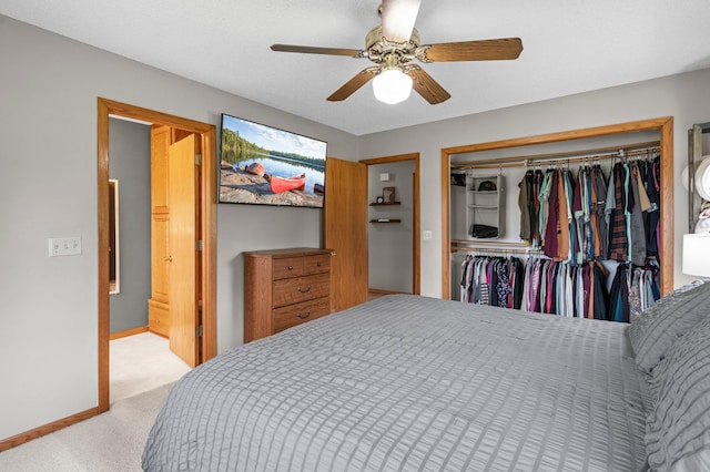 32147 111 1/2 St, Baldwin Twp, MN 55371 - bedroom featuring light carpet, a closet, baseboards, and ceiling fan