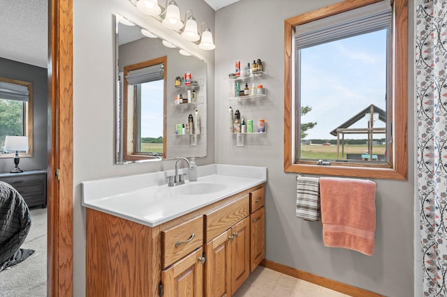 32147 111 1/2 St, Baldwin Twp, MN 55371 - bathroom with vanity and baseboards