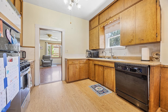 1307 5th St S, Fargo, ND 58103 - kitchen featuring dishwasher, a ceiling fan, stainless steel gas range oven, light wood-style floors, and light countertops