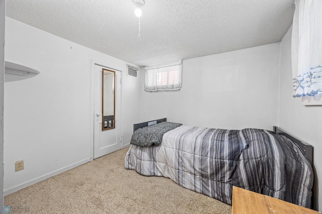 1307 5th St S, Fargo, ND 58103 - bedroom featuring a textured ceiling and carpet