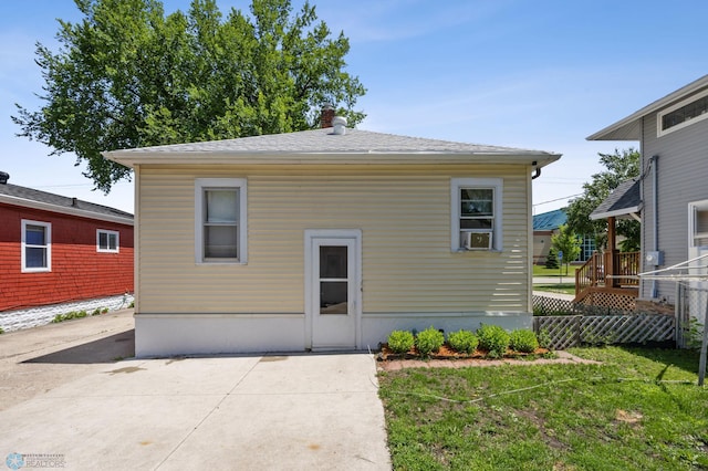 1307 5th St S, Fargo, ND 58103 - back of house featuring a patio area and a chimney