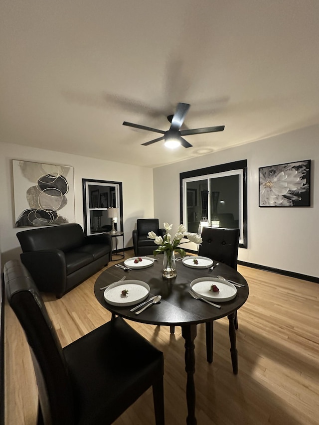 644 82nd Ave NE, Spring Lake Park, MN 55432 - dining area featuring light wood-type flooring and a ceiling fan